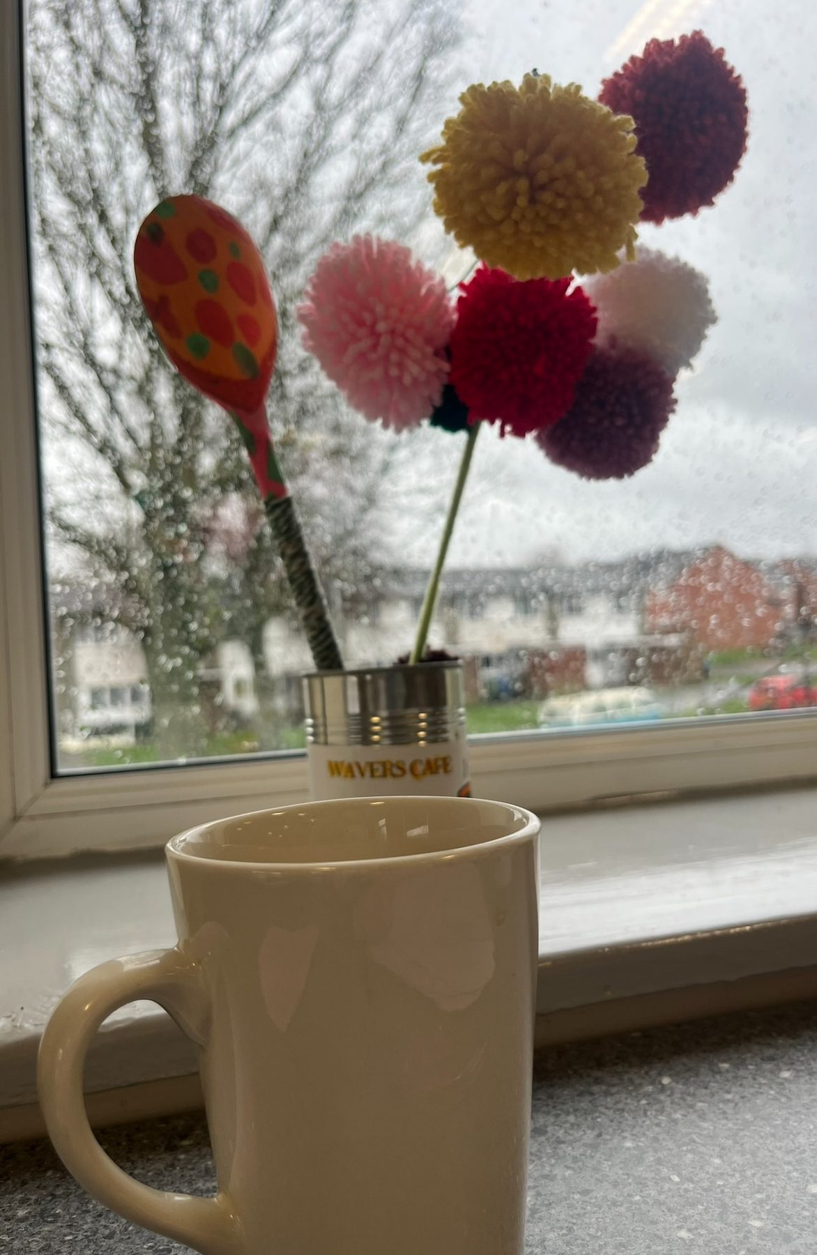 Mug and pom-pom flowers